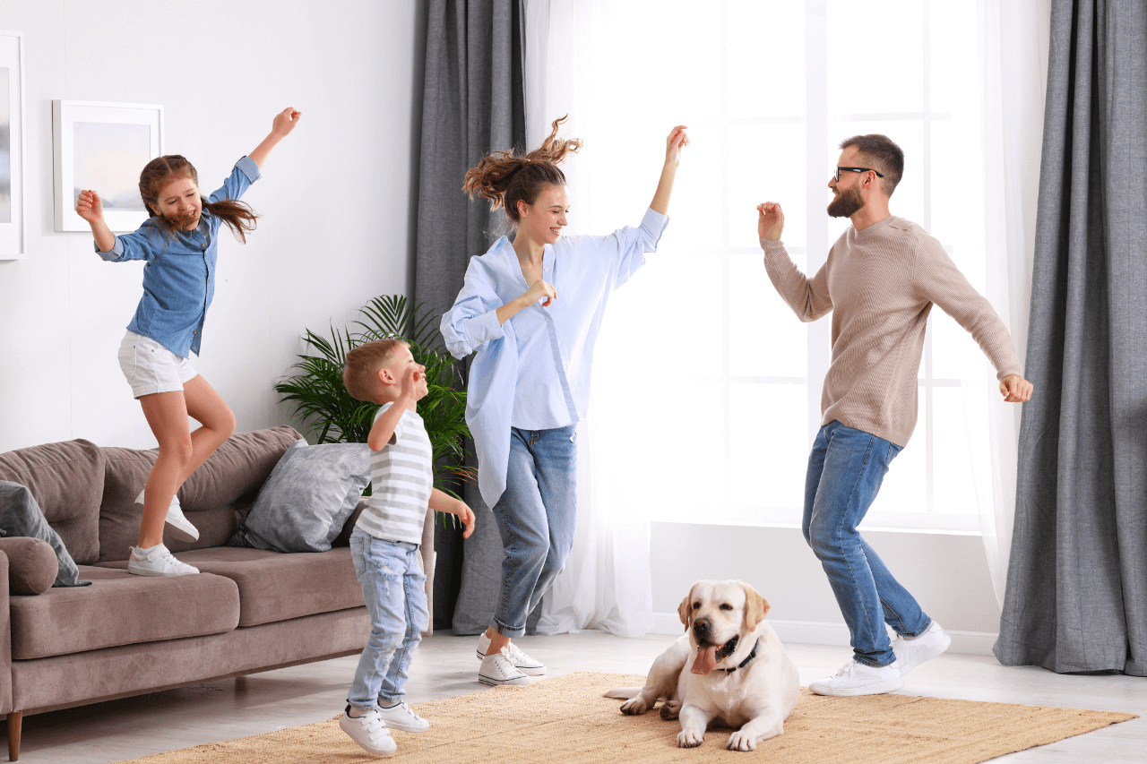 happy family jumping around in the livingroom