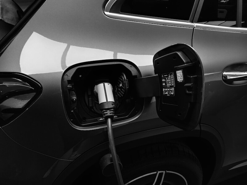 electric car plugged into a residential charging station