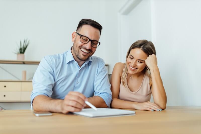 couple discussing heat pump financing options for their home in newfoundland