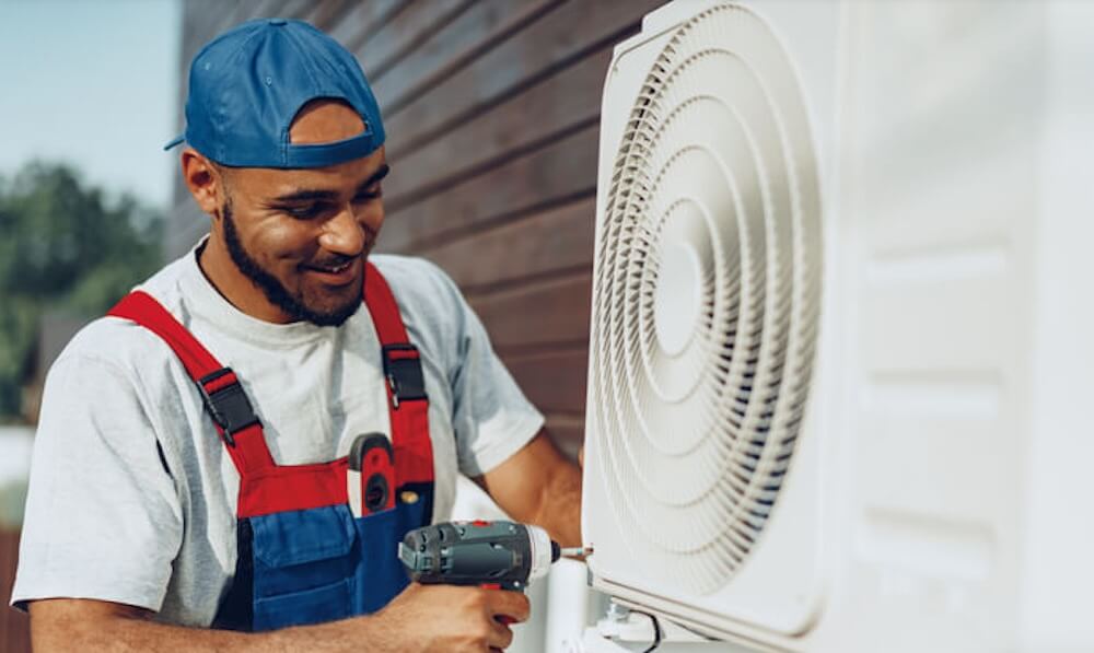 hvac technician installing a residential heat pump system