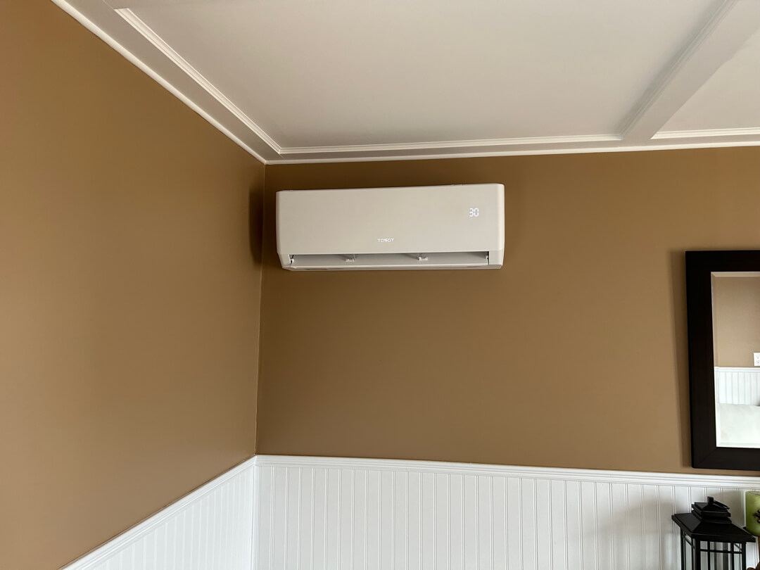 indoor mini split unit mounted on wall for quiet, efficient climate control