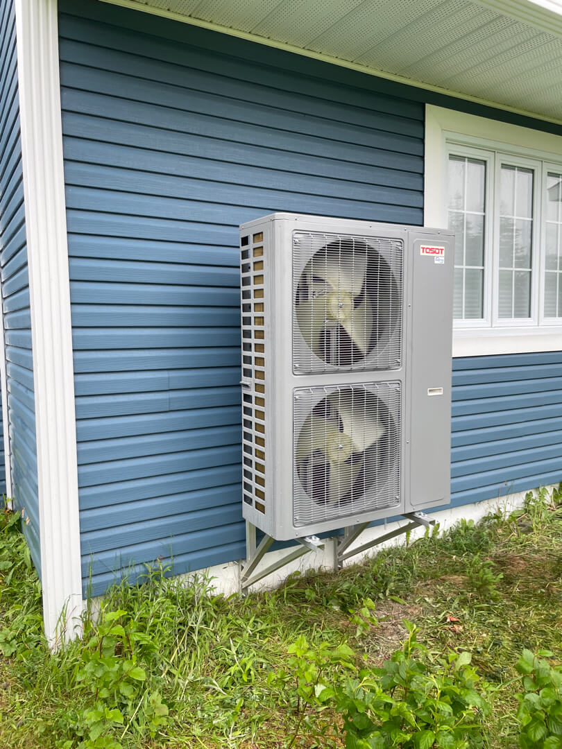 Tosot double outdoor heat pump unit installed for residential heating and cooling