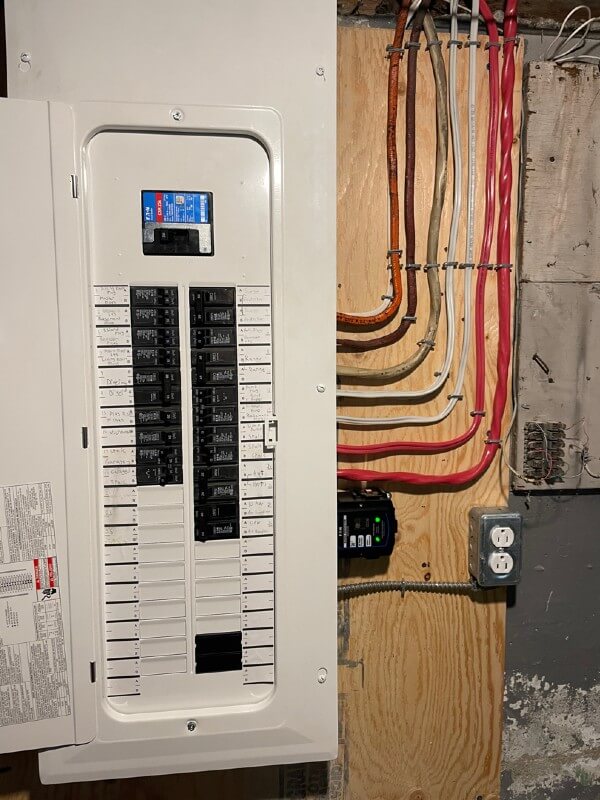 image of a white residential electric panel installed in a home in newfoundland